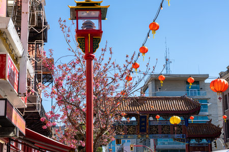 Victoria, BC, Canada - April 14 2021 : Victoria Chinatown, with the Gate of Harmonious Interest in the background. The oldest Chinatown in Canada and the second oldest in North America.のeditorial素材