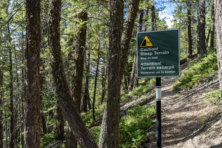 Stay on trail sign signpost at Tunnel Mountain Trail. Banff National Park, Canadian Rockies.のeditorial素材