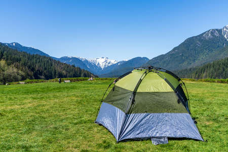 Capilano Lake Cleveland Park in springtime sunny day. Leisure and camping concept. North Vancouver,...