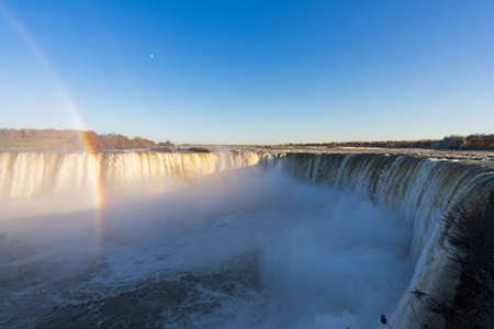 Horseshoe Falls in a sunny day with rainbow. Niagara Falls, Ontario, Canada.