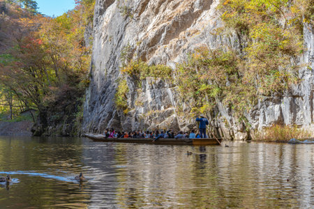 Geibikei Gorge River Cruises in Autumn foliage season. Beautiful scenery landscapes view in sunny weather day. Ichinoseki, Iwate Prefecture, Japanのeditorial素材