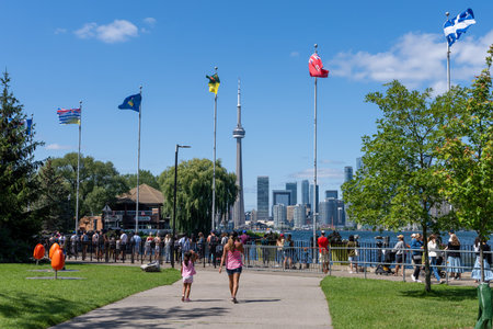 Toronto, Ontario, Canada - July 30 2021 : Passengers queue at the Island Ferry Dock. Centre Island Ferry wharf.のeditorial素材