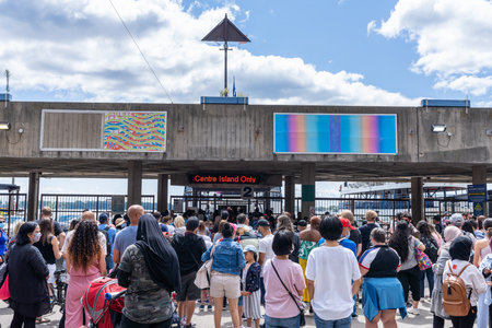 Toronto, Ontario, Canada - July 30 2021 : Jack Layton Ferry Terminal, Passengers queue at the Island Ferry Dock. Centre Island Ferry wharf.のeditorial素材