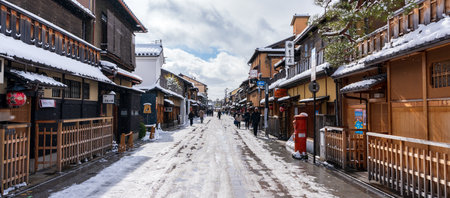 Kyoto, Japan - January 24 2023 : Hanamikoji Street with snow in winter. Gion District.のeditorial素材