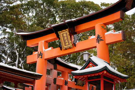 Kyoto, Japan - January 24 2023 : Fushimi Inari-taisha Torii Gates with snow on the roof in winter.のeditorial素材