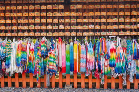 Kyoto, Japan - July 23 2023 : Thousand folded paper cranes and ema votive pictures in Azumamaro Shrine (Azumamaro Jinja) in the Fushimi Inari Taisha Shrine.のeditorial素材