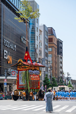 Kyoto, Japan - July 24 2023 : Gion Matsuri Festival, Yamaboko Junko Procession. People pulling the large wooden traditional float parade on the city street.のeditorial素材