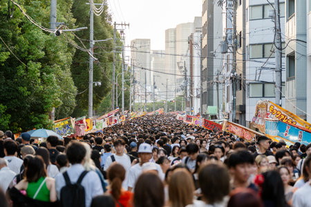 Osaka, Japan - July 25 2023 : Crowd of people walking on the street during Tenjin Matsuri Festival.