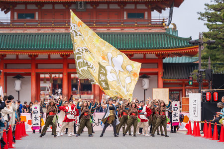 Kyoto, Japan - March 31 2024 : Kyoto Sakura Yosakoi ( Sakuyosa ) festival. A group of dancers dancing down a street at the Okazaki area around Heian Shrine.のeditorial素材