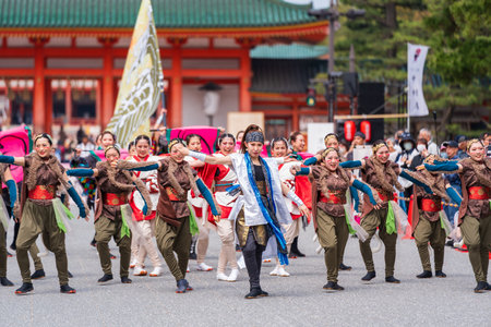 Kyoto, Japan - March 31 2024 : Kyoto Sakura Yosakoi ( Sakuyosa ) festival. A group of dancers dancing down a street at the Okazaki area around Heian Shrine.のeditorial素材