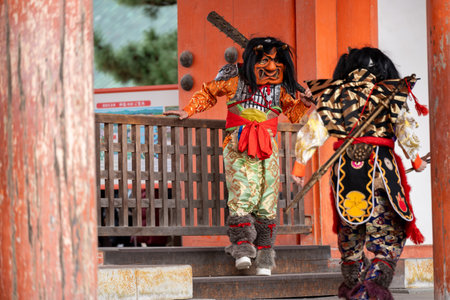 Kyoto, Japan - February 3 2024 : Heian Jingu Shrine Setsubun festival. Performers wearing an oni ( demon or ogre ) costume in the traditional Japanese shinto ritual ceremony.のeditorial素材