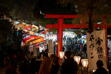 Kyoto, Japan - February 2 2024 : Yoshida Shrine Setsubun matsuri festival. Japanese traditional street vendor at night.のeditorial素材