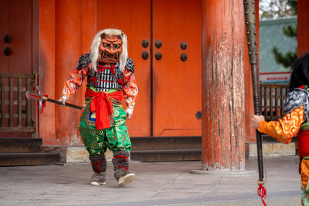 Kyoto, Japan - February 3 2024 : Heian Jingu Shrine Setsubun festival. Performers wearing an oni ( demon or ogre ) costume in the traditional Japanese shinto ritual ceremony.のeditorial素材