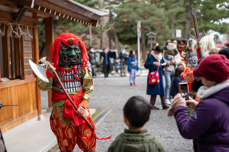 Kyoto, Japan - February 3 2024 : Heian Jingu Shrine Setsubun festival. Performers wearing an oni ( demon or ogre ) costume in the traditional Japanese shinto ritual ceremony.のeditorial素材