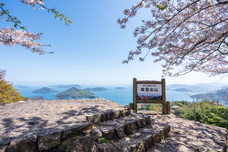 Kagawa, Japan - April 10 2023 : Mt. Shiude (Shiudeyama) Mountaintop Observatory. Cherry blossoms full bloom in the spring. Shonai Peninsula, Mitoyo, Kagawa, Shikoku.のeditorial素材
