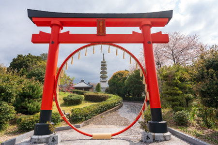 Mitoyo, Kagawa, Japan - April 9 2028 : Ise Asahiyama Hongu shrine in the Asahiyama Shinrin Park (Mt. Asahi Forest Park). Cherry blossoms in full bloom in Shikoku island.のeditorial素材