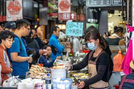 Local turnip cake vendor in Taichung Second Public Market. Old market has always been the favorite of backpack travelers, especially because of the food. Taichung, Taiwanのeditorial素材