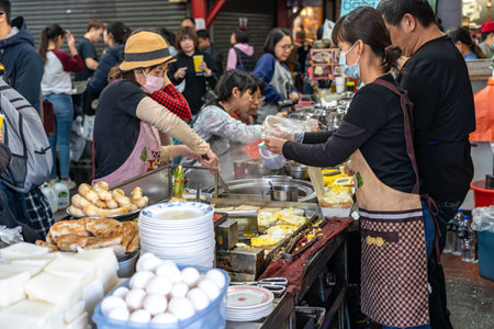 Local turnip cake vendor in Taichung Second Public Market. Old market has always been the favorite of backpack travelers, especially because of the food. Taichung, Taiwanのeditorial素材