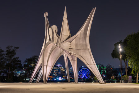 Montreal, Quebec, Canada - August 3 2021 : Sculpture Trois Disques aka L'Homme at night. Made for Expo 67. Jean-Drapeau park, Saint Helens Island.のeditorial素材
