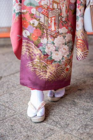 Vibrant Pink Traditional Japanese Kimono Furisode with Gold Accent and Zori Sandals.