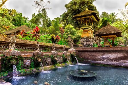 Gunung kawi Sebatu Temple with fountains, a pagoda and plants in Bali, Indonesiaの写真素材