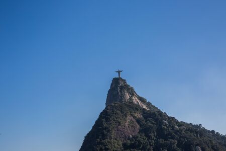 Christ the Redeemer statue (Cristo Redentor), a symbol of Christianity, on top of Mount Corcovado against a clear blue sky on a sunny day in Rio de Janeiro, Brazil, South Americaのeditorial素材