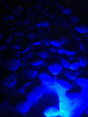 Blue light in the water and cobblestone as decoration.の素材