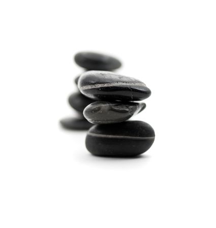 Two pebble pyramids over white backgroundの写真素材