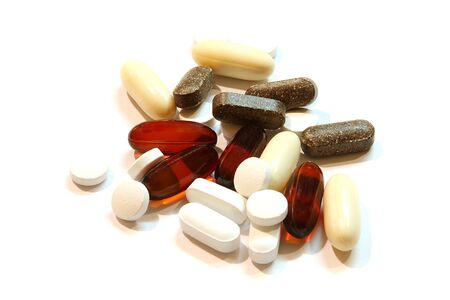 Assorted pills over white backgroundの写真素材