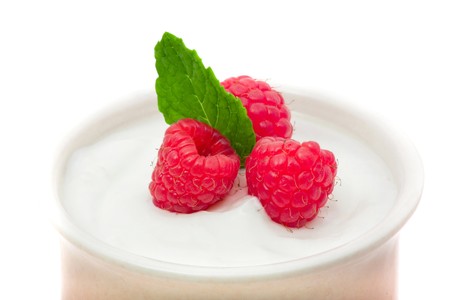 Delicious raspberries on top of greek yogurt
