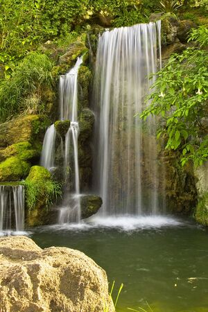 Beautiful waterfall with lake in the forestの写真素材