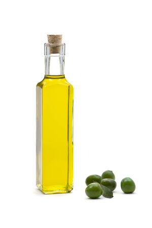 Bottle of olive oil with olives over white backgroundの写真素材