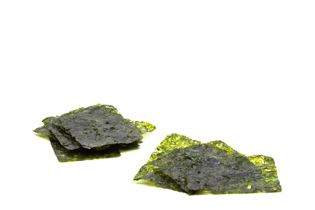 Roasted seaweed snack (kim nori) over white backgroundの写真素材