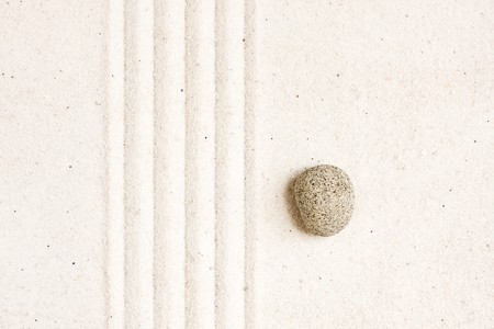 Close up of sand zen garden with stoneの写真素材