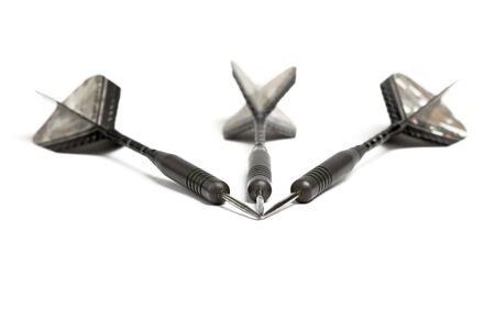 Three darts with selective depth of field over white backgroundの写真素材