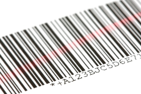 Digital bar code scanned by laser over white backgroundの写真素材