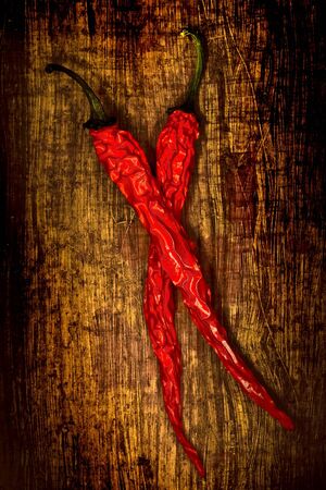 Dried pepperoni on wooden background grunge styleの写真素材