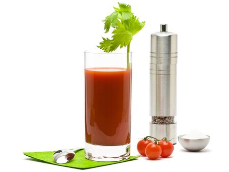 Bloody mary - mix drink from vodka and tomato juice with salt and pepper on white backgroundの写真素材