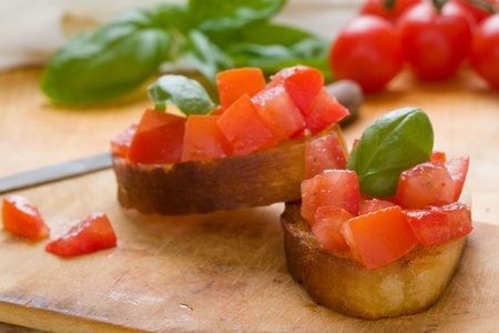 Delicious italian tomato bruschetta on toasted breadの写真素材