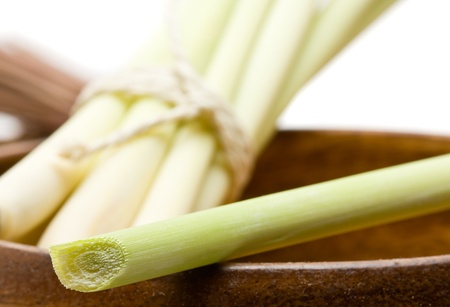 Fresh organic lemongrass bundle in wooden bowlの写真素材