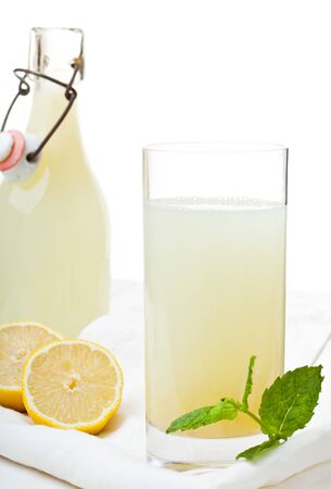 Fresh homemade glass of lemonade on a wooden tableの写真素材