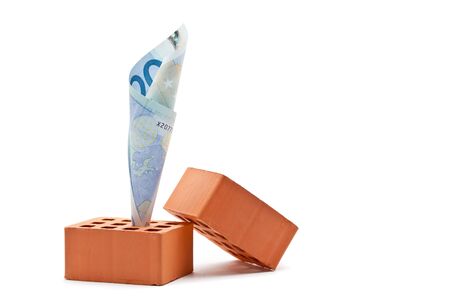 Euro banknote in brick - house building costs conceptの写真素材