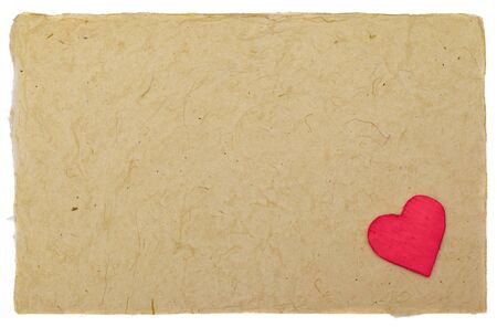 Little red heart on vintage paper with copyspaceの写真素材