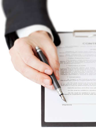 Businessman points on signature line on contractの写真素材