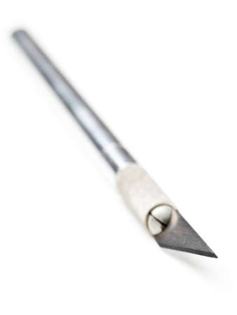 Stainless steel scalpel with selective focus isolated on white backgroundの写真素材