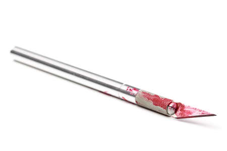Stainless steel scalpel covered in blood isolated on white backgroundの写真素材