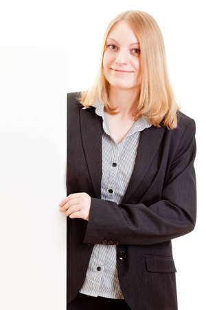 Young attractive business woman holding sign with copy space isolated on white backgroundの写真素材