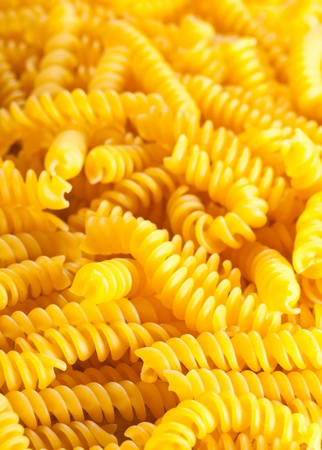 Background from raw italian spirelli  fusilli  pastaの写真素材