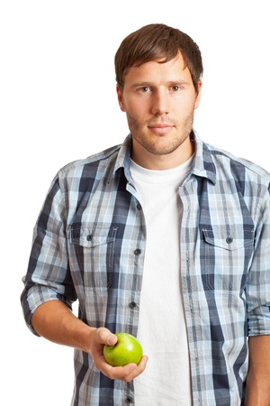 Young man eating an apple - healthy diet conceptの写真素材