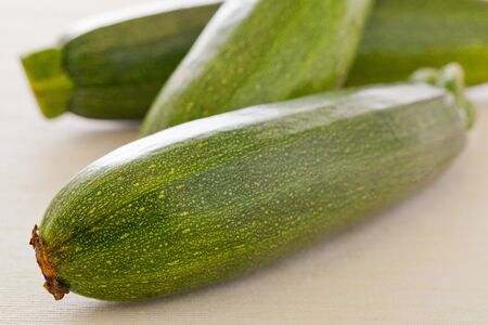 Fresh cut organic zucchini on kitchen tableの写真素材